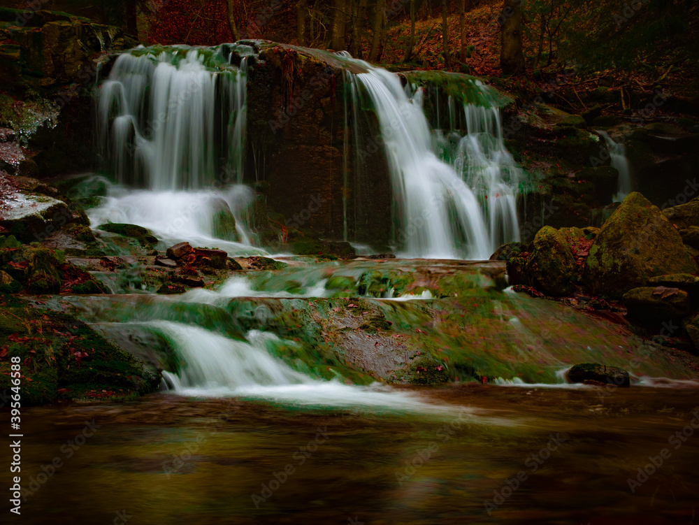 Wild brook with stones and waterfall in Jeseniky mountains, Eastern Europe, Moravia. Clean fresh cold watter, water stream. Long exposure image. .