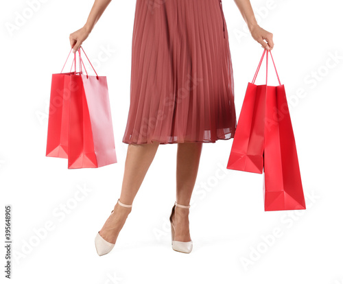 Woman with shopping bags on white background, closeup. Black Friday Sale