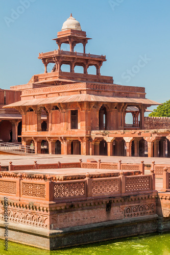 Panch Mahal palace and Ornamental pool in the ancient city Fatehpur Sikri, Uttar Pradesh state, India photo