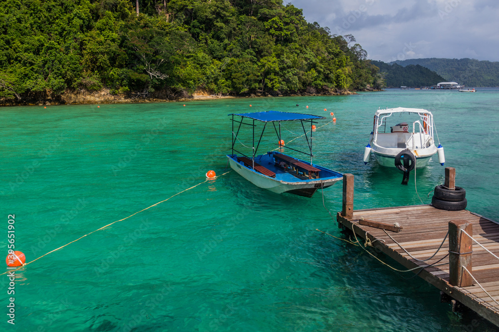 Boats at a pier at Gaya Island in Tunku Abdul Rahman National Park, Sabah, Malaysia