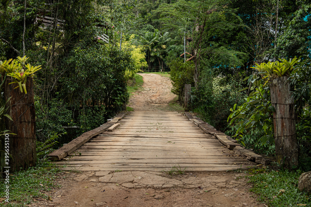 Wooden bridge on the dirt road Wooden bridge on the dirt road