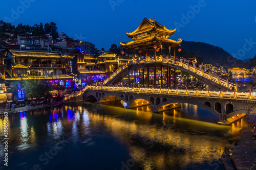 Evening view of Fenghuang Ancient Town with Xueqiao Snow bridge, Hunan province, China