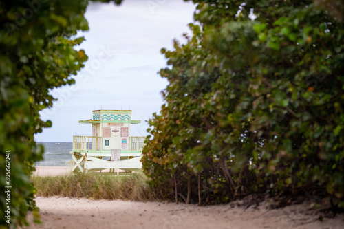 View of a Miami Beach lifeguard stand between the dunes photo