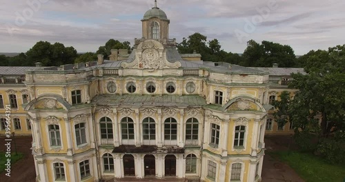4K cloudy day aerial drone video of beautiful vintage architecture of Znamenka Estate, green park and palace near Peterhof center, in the suburbs of Saint Petersburg, the Russia's northern capital