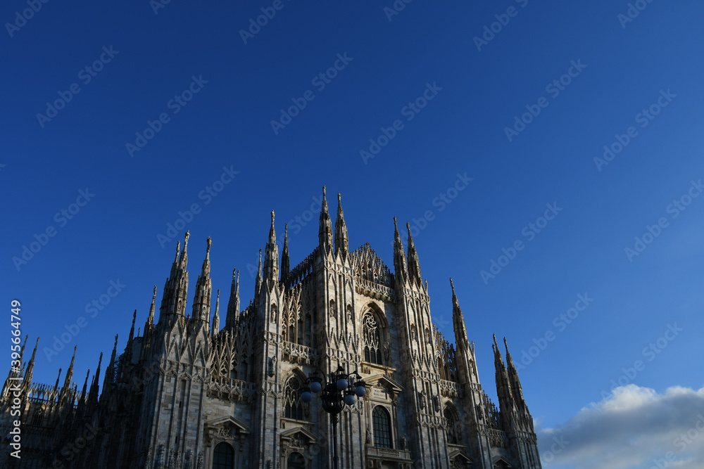 The Milan Cathedral (Duomo di Milano) seen against a blue sky