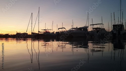 Marina Sveva touristic port at sunset. Slow-motion photo