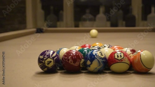 Billiards table with pool ques and balls. photo