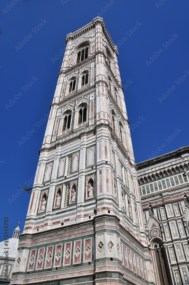 Giotto's campanile or bell tower is resplendent structure beautifully decorated. The bell tower complements the Duomo .