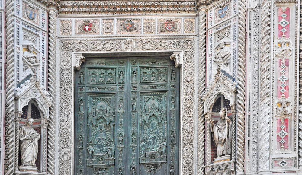 A beautiful and intricately carved door of the Duomo Florence's celebrated landmark cathedral.