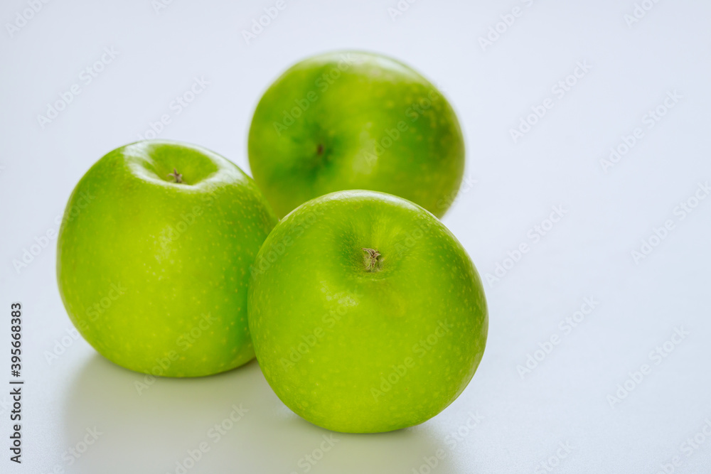 Whole green apples and isolated on white background. Whole green apples and isolated on white background.