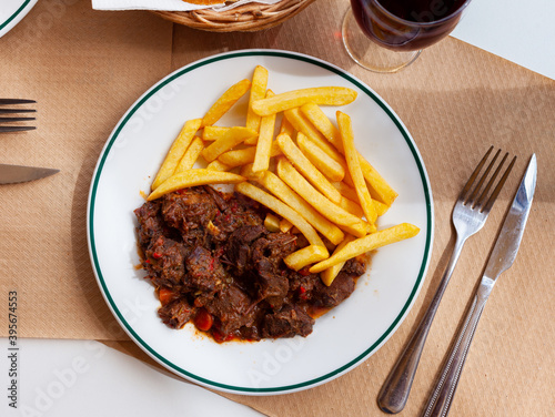 Wild boar meat stew with garnish of french fries