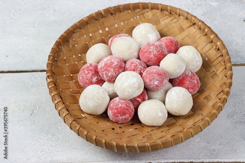 Moci merah putih. Red and White Mochi or moci cake. One of traditional snack from Indonesia. Made from glutinous rice flour with sugar and roasted peanut filling. photo