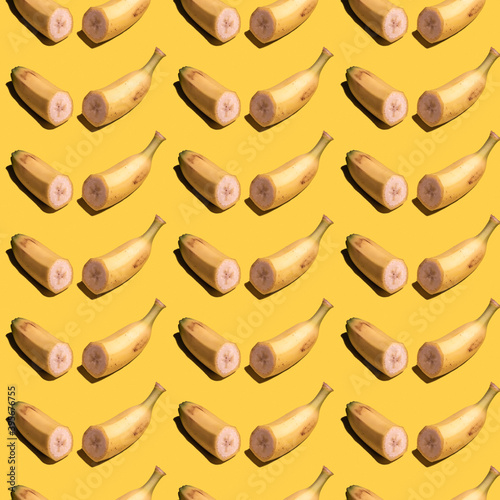 Seamless pattern with banana on yellow background.