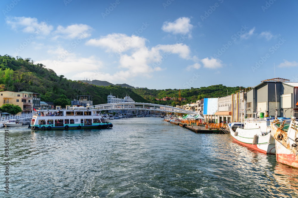 Fototapeta premium Ferry crossing Kaohsiung Harbor, Taiwan. View of Gushan Marina