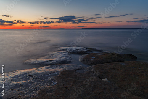 Late summer sunset on shore of the Baltic Sea   rocky coast. Estonia.
