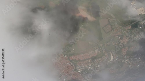 Parachutist's point of view when crossing the clouds and seeing his own shadow. photo