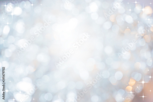 abstract blur white and silver color background with star glittering light for show,promote and advertisee product and content in merry christmas and happy new year season collection concept 