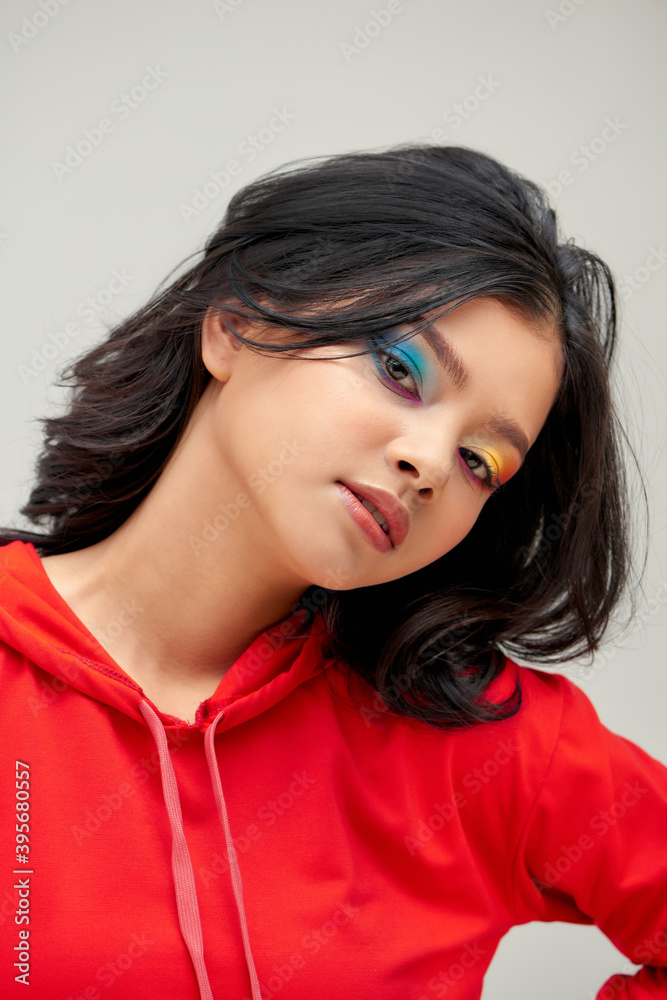 Glamour fashion model with bright make-up, at studio. Glamour fashion model with bright make-up, at studio.