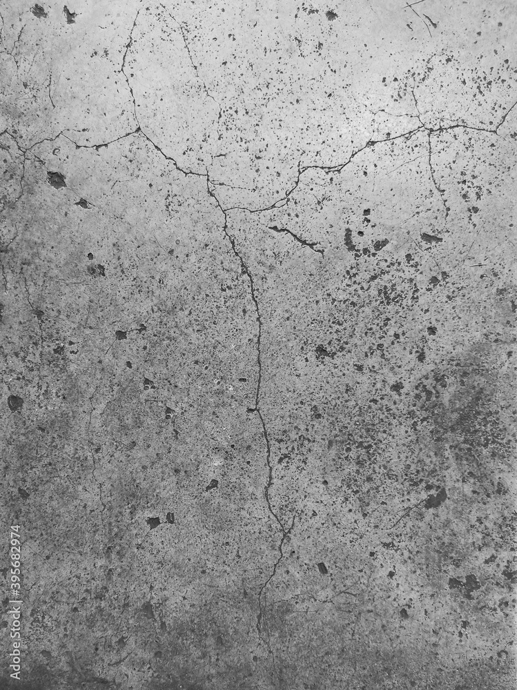 Obraz premium The floor old cement surface has cracks. Vertical images for background, wallpaper, design, text..