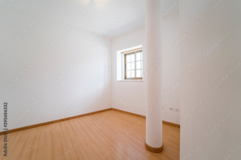 Fototapeta premium Empty room with wooden floating laminate flooring and window. House interior, wide bedroom space. Newly recently painted new apartment or house. Wood floor. Real state and property management