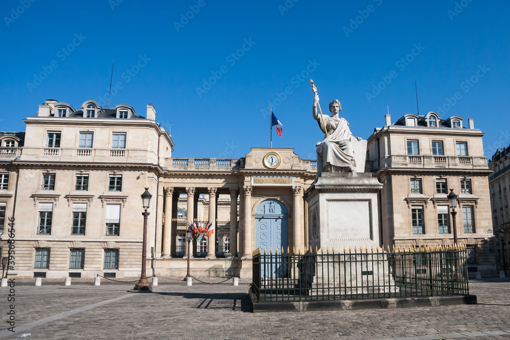 French National Assembly or Bourbon Palace back entrance on University Street) with Law statue in Paris, France.
