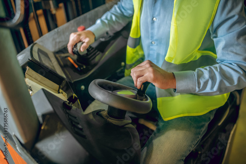 Close up picture of amn sitting in the loader