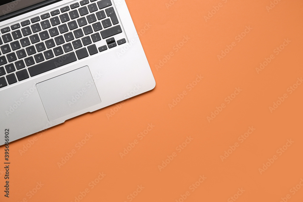 Modern laptop on color background, closeup