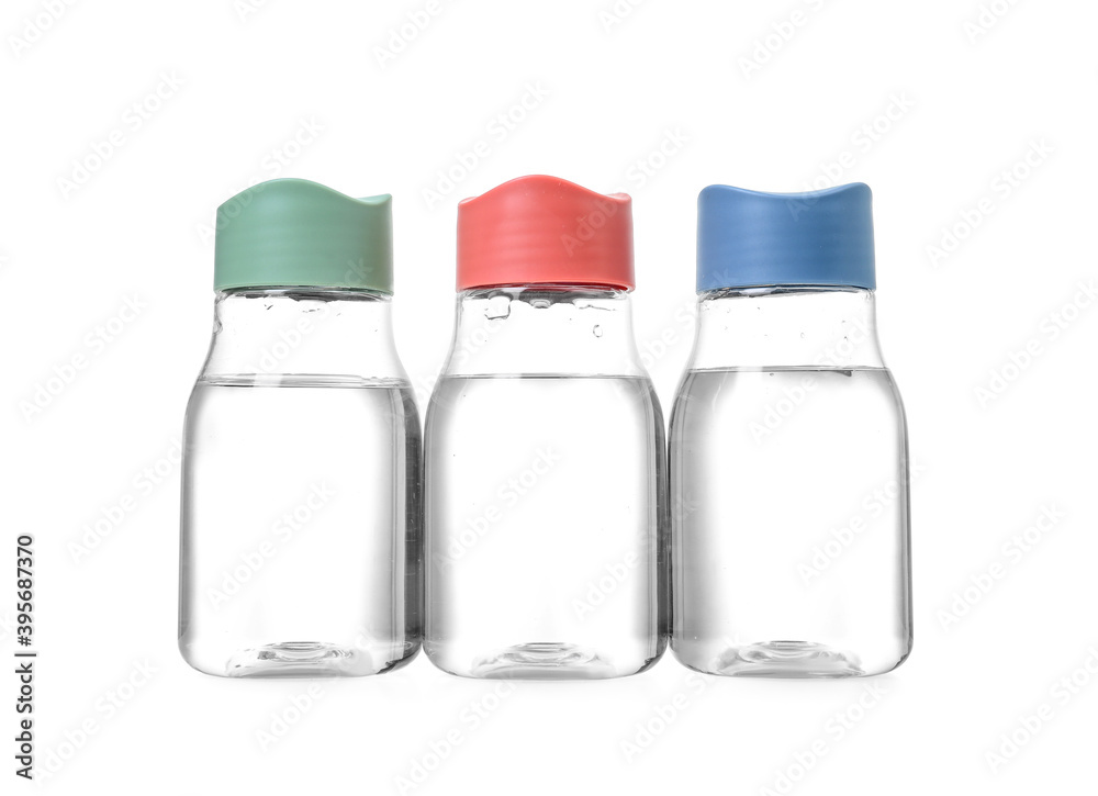 Bottles of clean water on white background