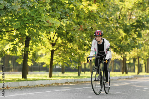 Wallpaper Mural Female cyclist riding bicycle outdoors Torontodigital.ca