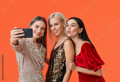 Beautiful young women takin...