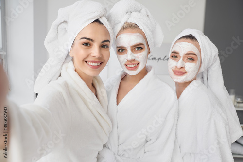 Beautiful young women taking selfie at pamper party