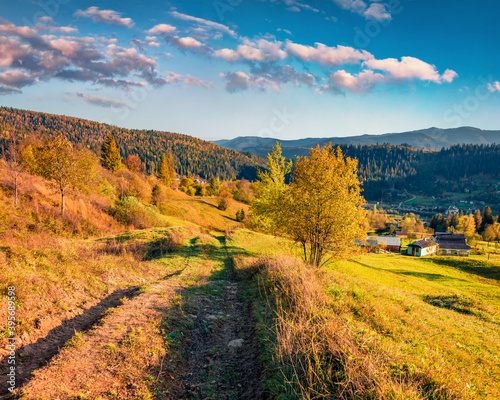 Colorful evening view of outskirts of popular tourist resort - Yaremche. Fantastic sunset in Carpathian mountains. Great autumn landscape. Traveling concept background..