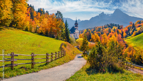 Fototapeta Naklejka Na Ścianę i Meble -  Iconic picture of Bavaria with Maria Gern church with Hochkalter peak on background. Sunny autumn scene of Alps. Beautiful landscape of Germany countryside. Beautiful autumn scenery.