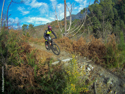 A biker on a single track on Versilia's hills, Tuscany