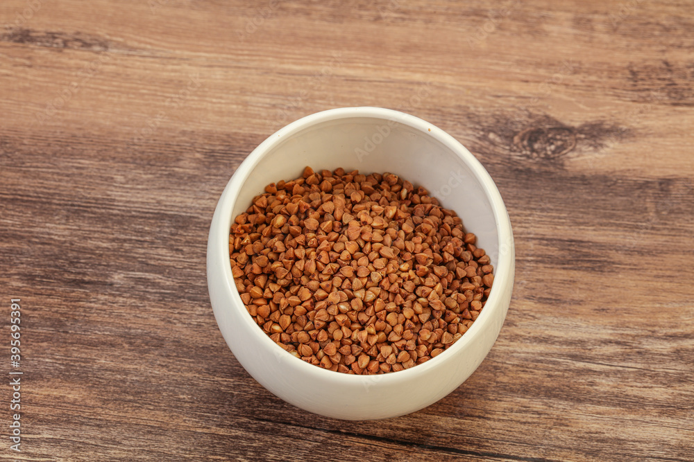 Raw buсkwheat cereal in the bowl Raw buсkwheat cereal in the bowl
