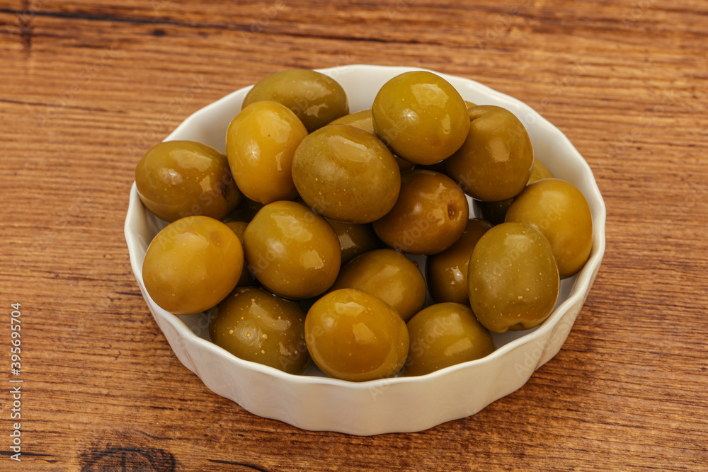 Green pickled olives in the bowl Green pickled olives in the bowl