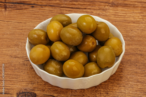 Green pickled olives in the bowl