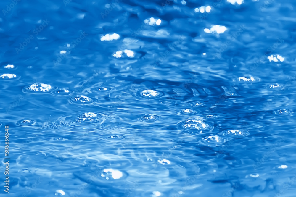 bubbles on the surface of the water stream / clear natural water, fast current, small river abstract background