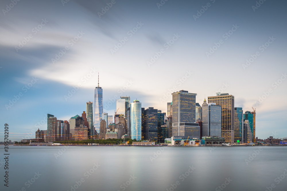 Fototapeta premium New York, New York, USA skyline on the bay at twilight.