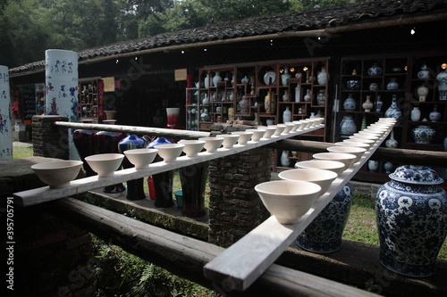 View of Drying Porcelain bowls clay body on row of wooden boards at Ancient ceramic Kiln in Jingdezhen, Jiangxi, China. 