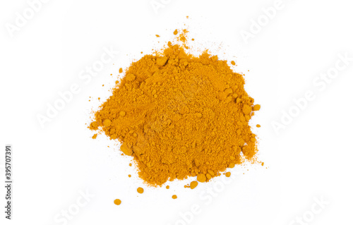yellow turmeric powder on the white background