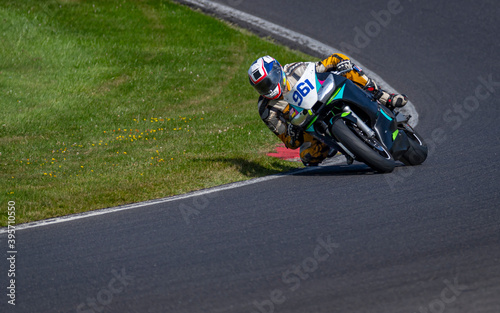 A shot of a racing bike cornering on a track.