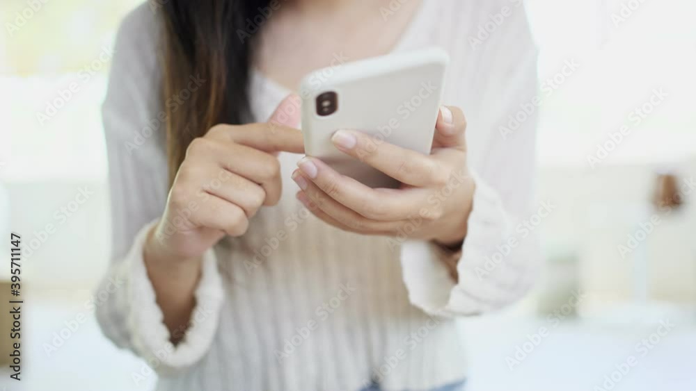 Young asian woman using smart phone at cafe, selective focus, 4k hand held vdo. Young asian woman using smart phone at cafe, selective focus, 4k hand held vdo.