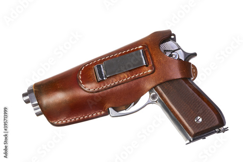 Pistol in leather holster turned left side