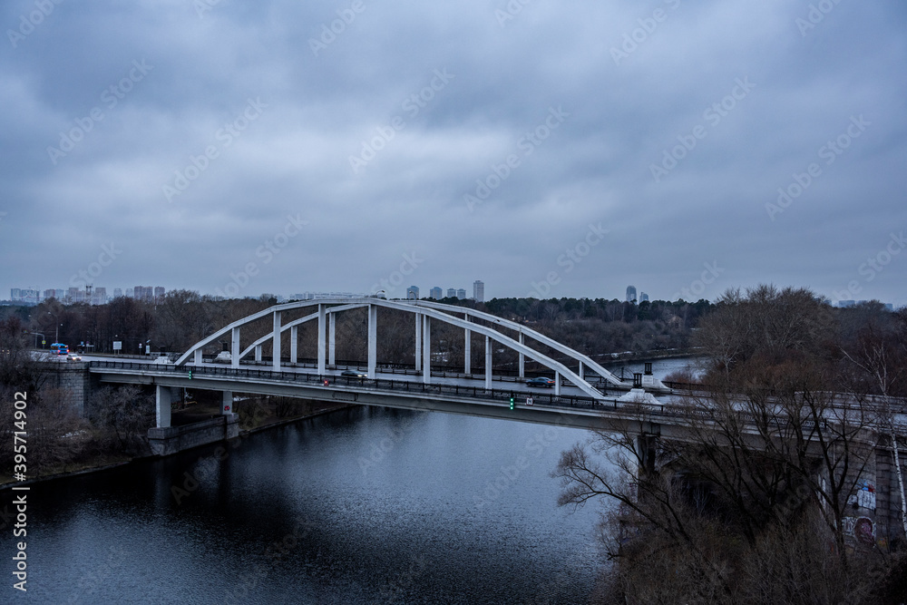 Naklejka premium red cable-stayed bridge and freeway at sunrise on winter morning