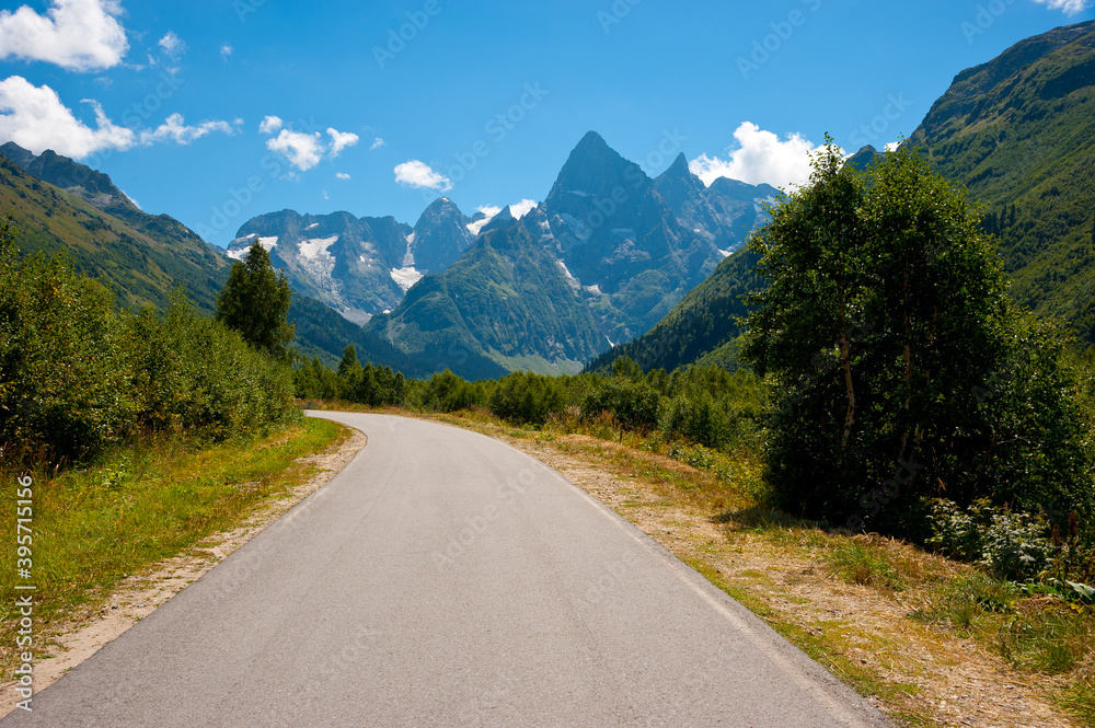 Fototapeta premium The road to the Gonachkhir tract, Dombay - road in the mountains. 