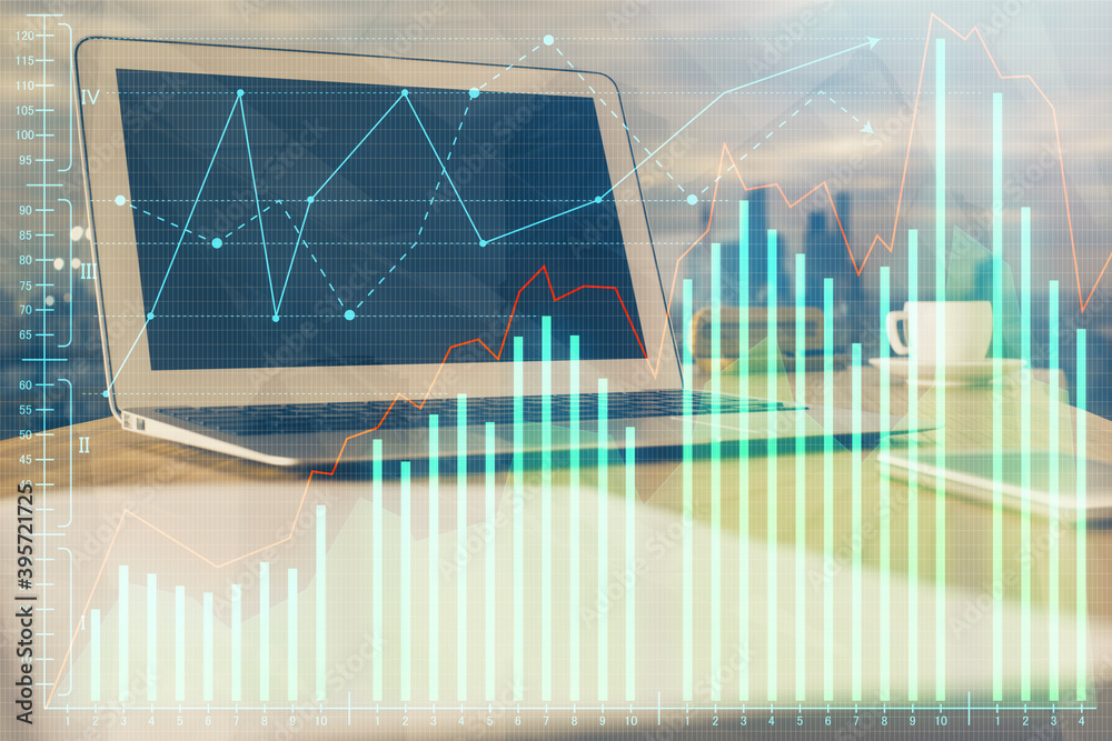Financial graph colorful drawing and table with computer on background. Double exposure. Concept of international markets. Financial graph colorful drawing and table with computer on background. Double exposure. Concept of international markets.
