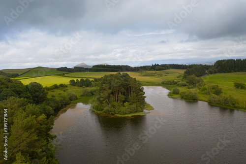 island in a lake on a dramatic day with dramatic skyline 