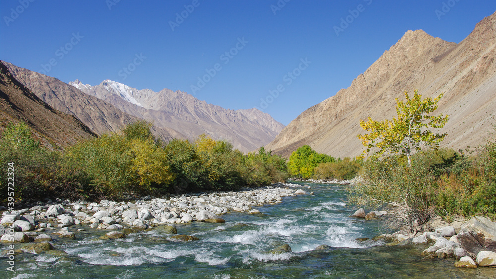 Spectacular autumn view of the Gunt river valley with turquoise blue water , Gorno-Badakshan region, in the Pamir mountains of Tajikistan