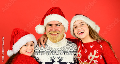 Christmas becomes special with children. Christmas eve concept. Winter holidays. Family time. Holly jolly christmas. Dad and kids having fun. Father and little daughters celebrate new year together